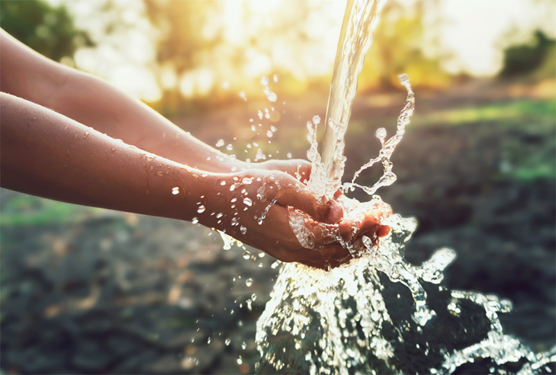 water flowing into hands